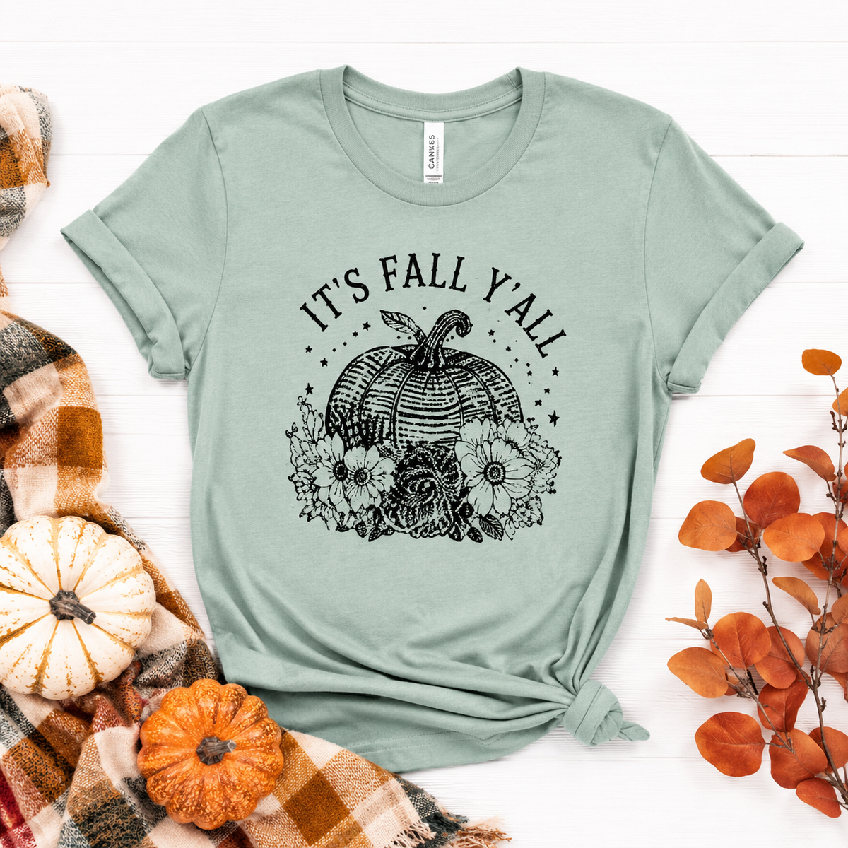 Sage green t-shirt with vintage floral pumpkin graphic and It's Fall Y'all text
