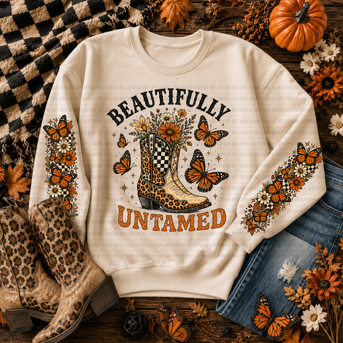 Cream Beautifully Untamed sweatshirt with western boot, orange butterflies, and floral artwork