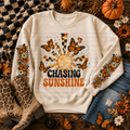 Chasing Sunshine sweatshirt with orange butterflies and sun artwork