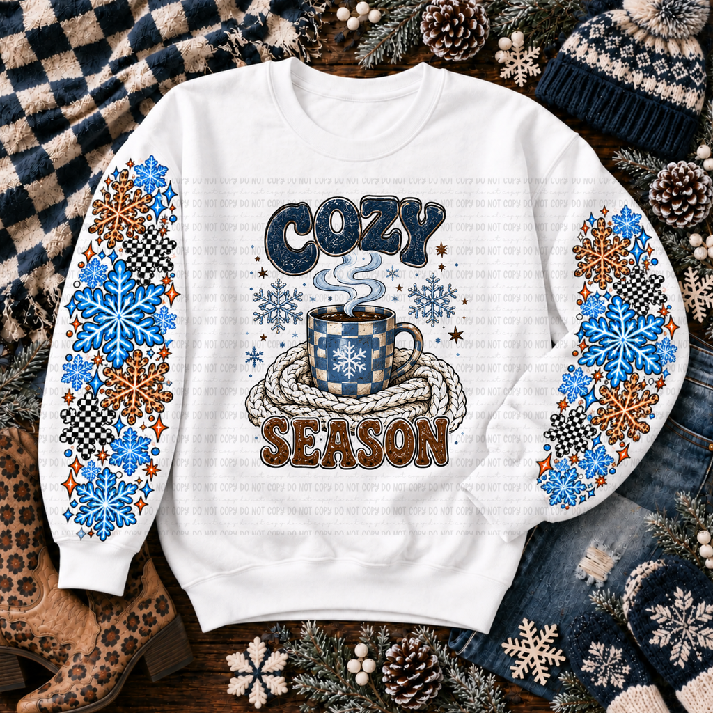 White Cozy Season sweatshirt with a coffee cup, snowflakes, and winter details
