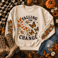 Cream Falling for Change sweatshirt with autumn leaves, orange butterflies, and seasonal details