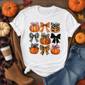 Pumpkins and bows fall graphic t-shirt on white tee with autumn flat lay styling