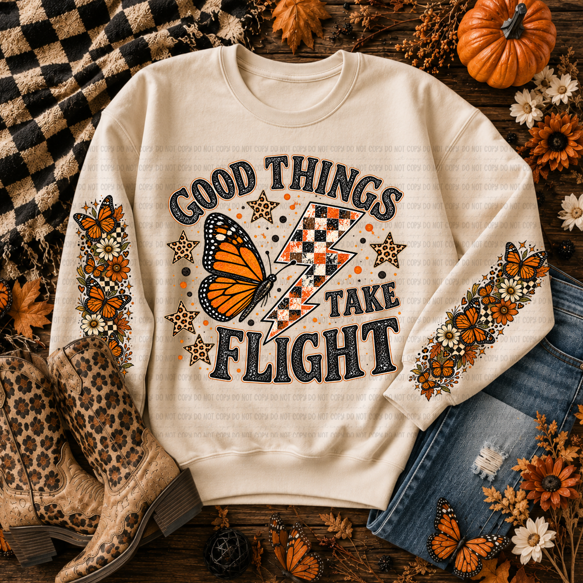 Cream Good Things Take Flight sweatshirt with an orange butterfly, lightning bolt, stars, and fall details