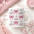 Pink ghost and bows Halloween mug with floral ghost graphic on white ceramic mug