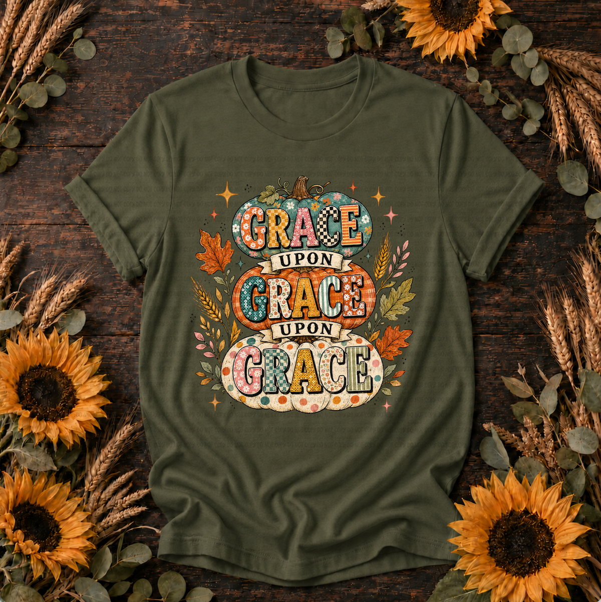 Grace Upon Grace T-Shirt with three stacked patterned pumpkins and autumn leaves design