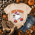 Cream T-shirt with a ghost roller-skating in pink bows and pumpkin skates