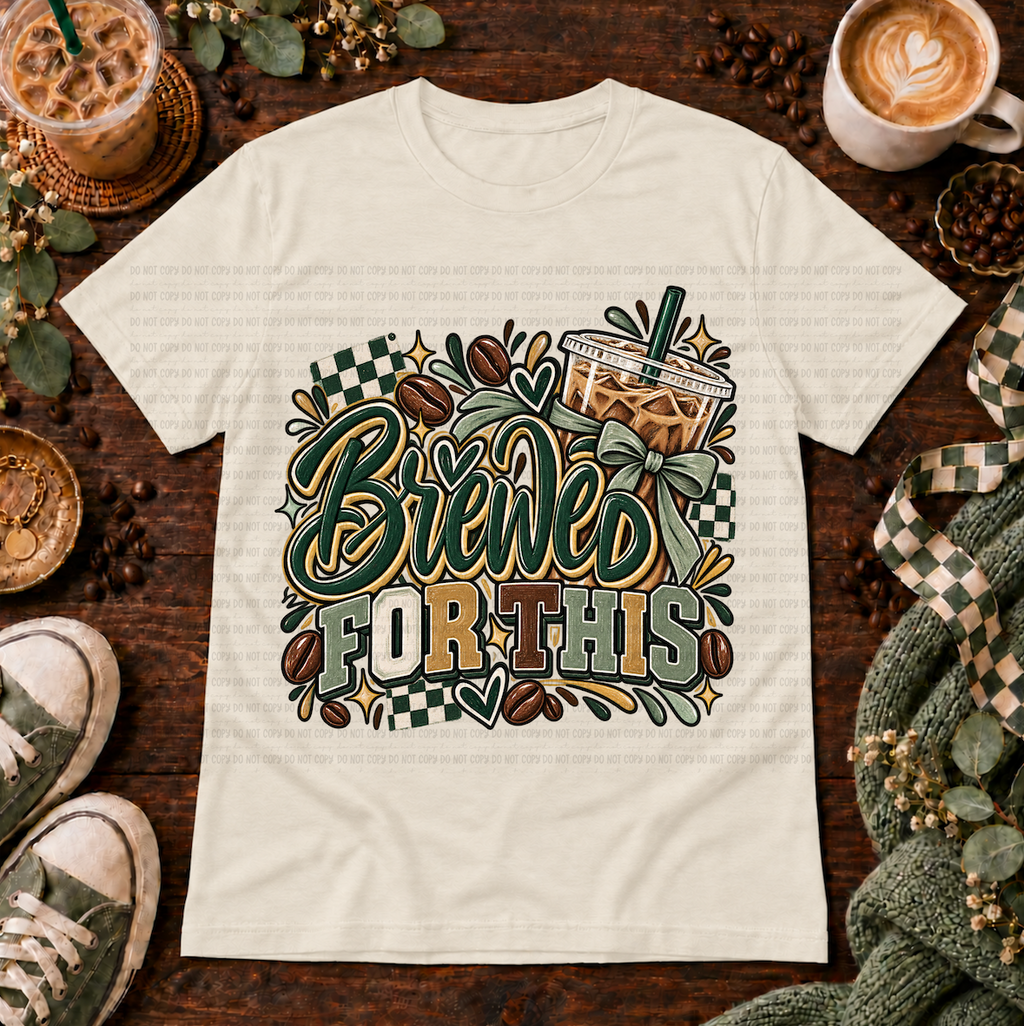 Cream graphic T-shirt with iced coffee, coffee beans, bows, and the phrase Brewed for This