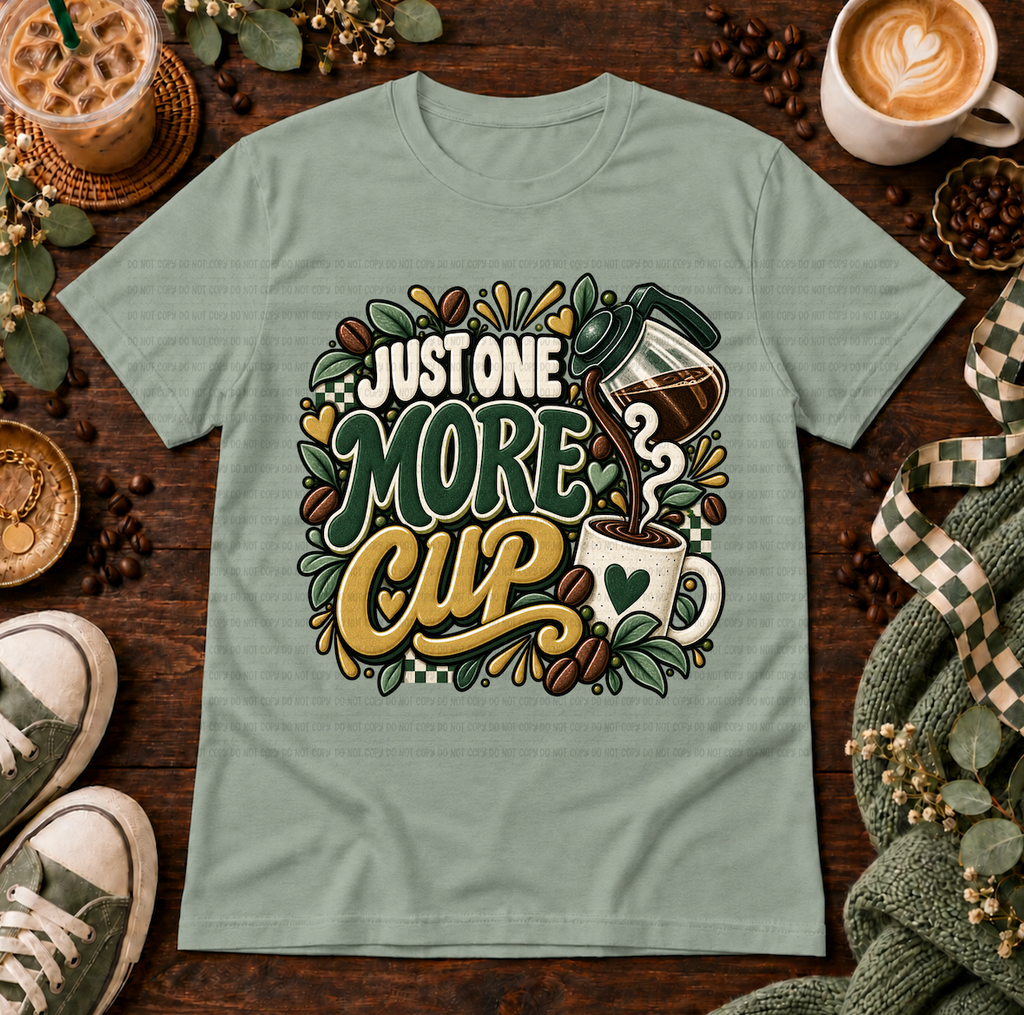 Sage green t-shirt with Just One More Cup coffee design